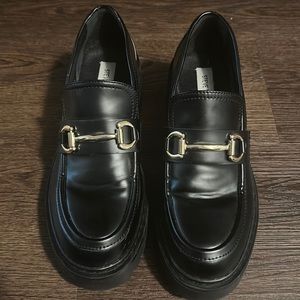 Black platform loafers